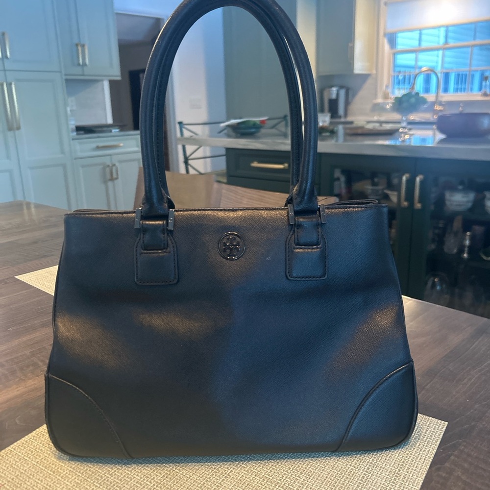 Classic Black Satchel with Structured Shape and Sturdy Handles